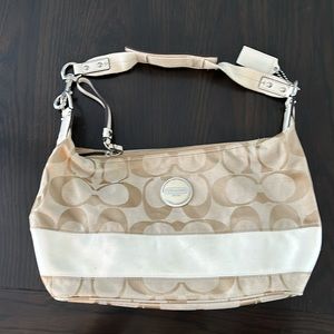 Tan and white coach bag